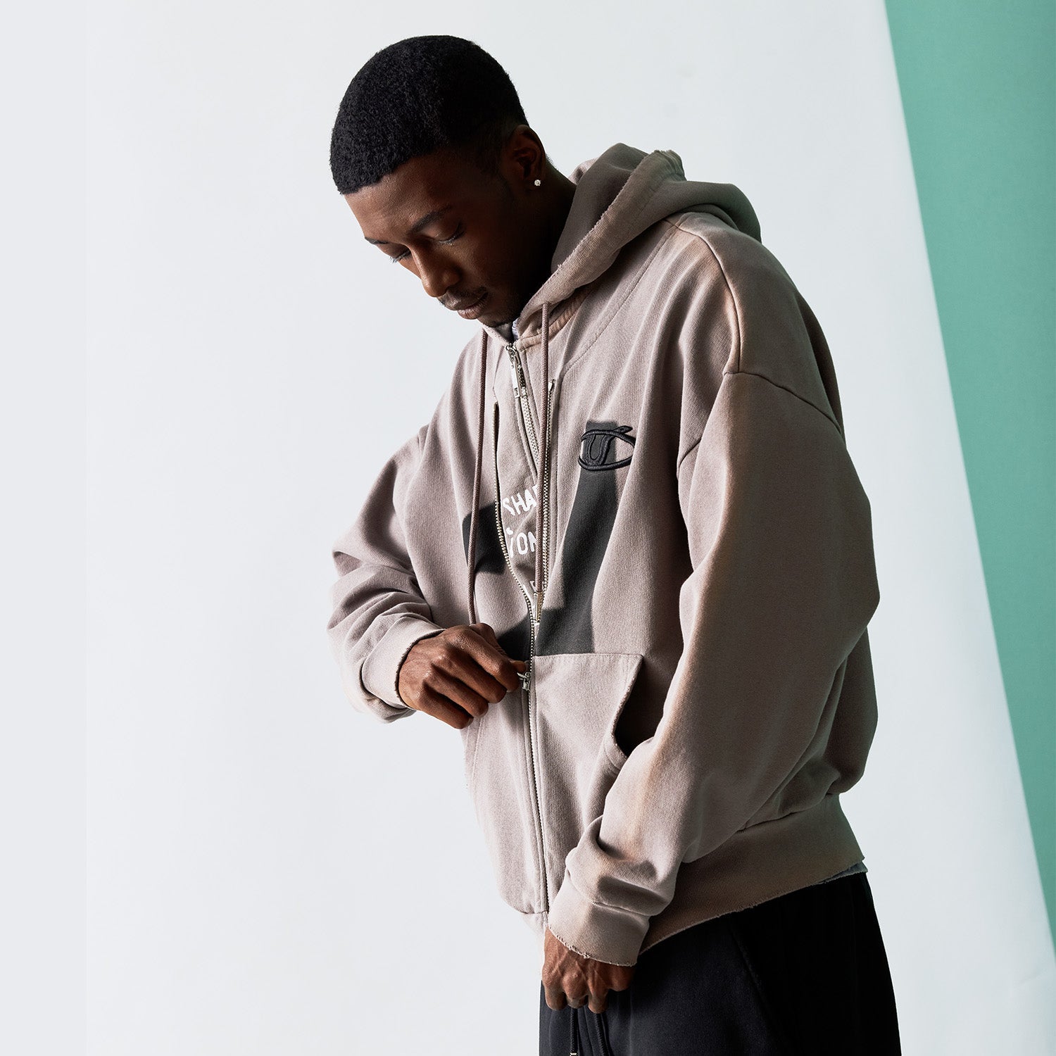 Model wear a zip up hoody by Vale clothing 